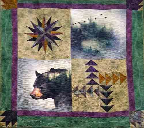 A four block panel with a bear, star block and flying geese block and green borders.